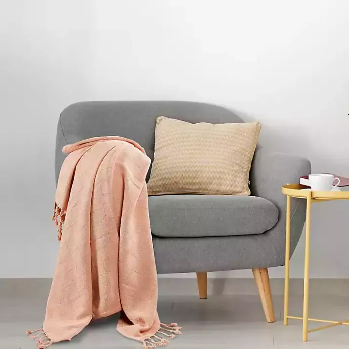 Kirklands Home Peach Checkered Weave Fringe Throw Pink